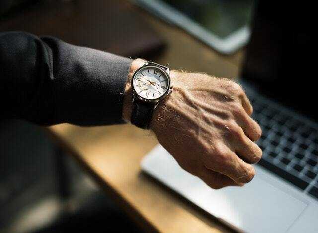 Man with a wrist clock